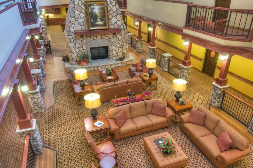 Cozy lodge-style atrium with fireplace at independent living Boise community