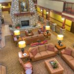 Cozy lodge-style atrium with fireplace at independent living Boise community