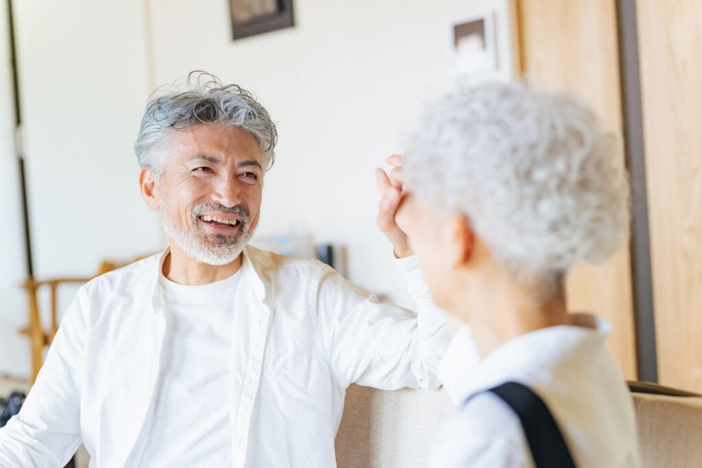 Two seniors sharing a joyful conversation reflecting peace of mind in senior living at Garden Plaza of Valley View